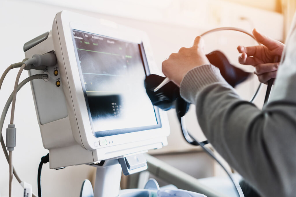 A nurse using a modern medical device